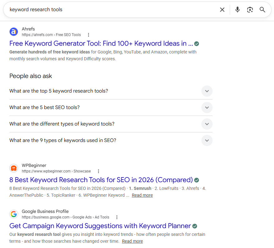 Google SERP for “keyword research tools” showing Ahrefs, WPBeginner, and Google Keyword Planner results
