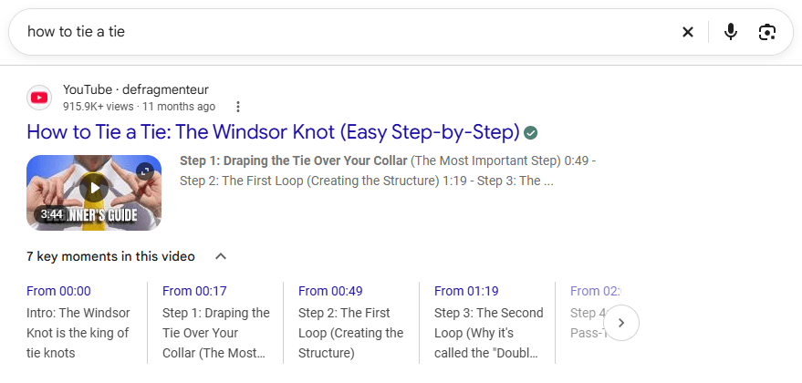 Google search result for “how to tie a tie” showing a YouTube video with thumbnail, duration, views, and seven timestamped Key Moments for different tutorial steps